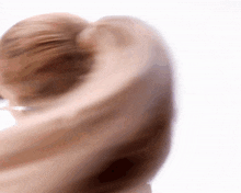 a close up of a person 's face with a blurred background