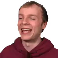 a man wearing a red hoodie is laughing with his mouth open