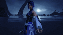 a woman with blue hair is standing in the water