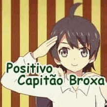 a boy is saluting with his hand on his forehead .