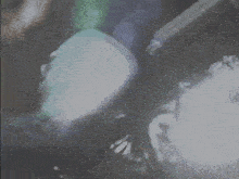 a blurred image of a person 's feet with the letter x in the corner