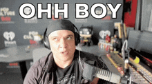 a man wearing headphones is making a funny face and says ohh boy