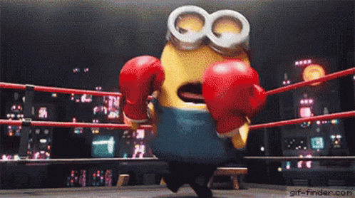 a minion in a boxing ring with gloves on