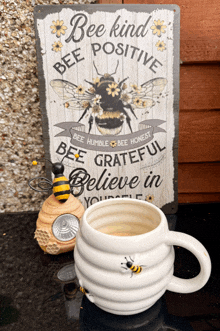 a sign that says bee kind bee positive and bee grateful