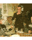 a man in a purple sweater is dancing in front of a table with wine glasses