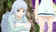 a girl with white hair is sitting on a rock while a girl in a white dress stands behind her