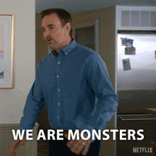 a man in a blue shirt says we are monsters in front of a netflix refrigerator