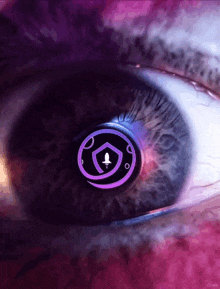 a close up of a person 's eye with a purple logo in the center
