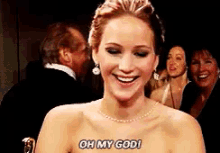 a woman in a dress is smiling and says oh my god