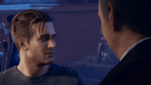 two men are looking at each other in a video game