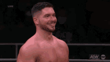 a man with a beard is blowing a kiss while standing in a ring .