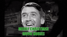 a black and white photo of a man with the words merry christmas movie house written below him