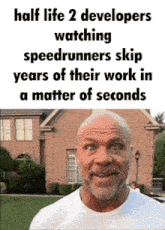 a bald man is standing in front of a brick building with a caption that says half life 2 developers watching speedrunners