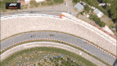 an aerial view of a race track with a sign that says replay on it