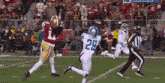 a football player with the number 29 on his jersey is running on the field