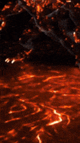 a monster with horns is surrounded by flames and lava