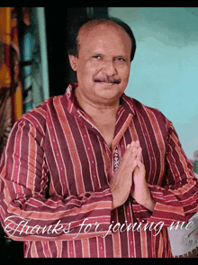 a man wearing a striped shirt with the words thanks for joining me below him