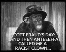 a black and white photo of a chimpanzee wearing a hat