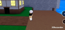 a person is standing in front of a house in a video game with xrecorder written on the bottom