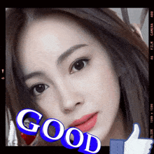 a close up of a woman 's face with the word good written on it