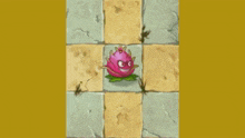 a cartoon drawing of a dragon fruit on a checkered surface