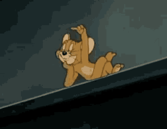 a cartoon cat is laying on a ledge holding a piece of paper in its mouth .