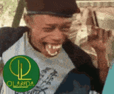 a man is making a funny face in front of a green circle with the word olanda on it
