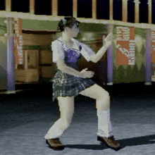 a woman in a plaid skirt is dancing in front of a sign that says ' coca cola ' on it