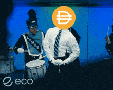a man with a coin on his head is playing drums in a band with the word eco in the bottom right corner