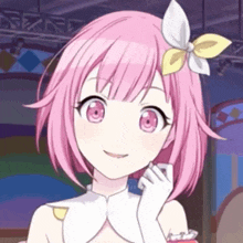 a close up of a pink haired anime girl with a flower in her hair .