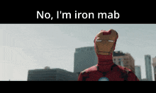 a man in an iron man costume is standing in front of a city skyline and says no i 'm iron mab