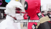 a man in a deadpool costume is blowing a kiss to another man in a white costume .