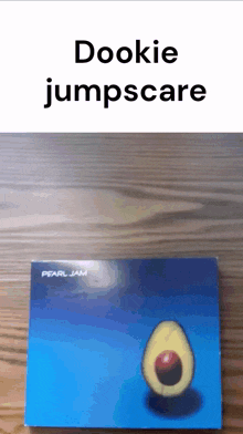 a pearl jam album with an avocado on it