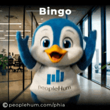 a penguin mascot is wearing a shirt that says bingo
