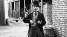 Charlie Chaplin Smoke GIF - Charlie Chaplin Smoke Cigar GIFs