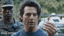 a movie poster for mission impossible the final reckoning shows a man holding a key