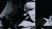 a black and white image of a person 's face with a blurry background