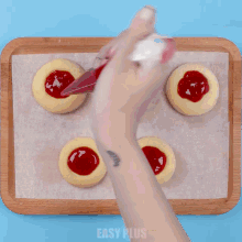 a tray of cookies with easy plus written on the bottom of the tray