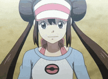 a girl wearing a pink and white hat and a blue shirt with a circle on it