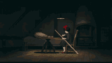 a girl is sitting at a table with a broom