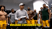 a group of green bay packers players stand in a locker room with the caption musgrave stayed on his feet