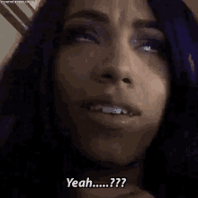 a close up of a woman 's face with purple hair and the words `` yeah ... ? ''