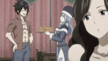 a man stands next to a woman holding a tray of cookies