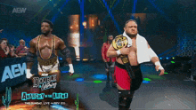 two wrestlers are walking on a stage with the words anarchy in the arena on the bottom