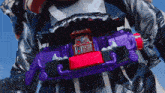 a close up of a purple and red toy with the number 14 on the top