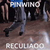 a man is dancing on a dance floor with the words pinwino recliaoo written above him