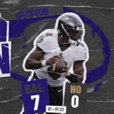 a ravens football player is holding a ball in his hands