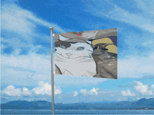 a flag with a picture of a cat on it flying in the wind
