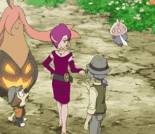 a group of people are standing next to each other on a dirt road .