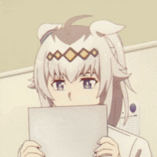 a girl with horse ears is holding a piece of paper in her hand